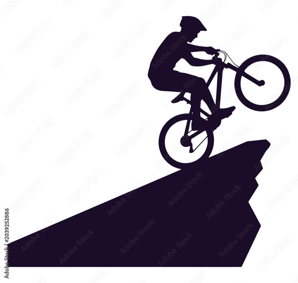 Naklejka premium Man riding a bicycle down a steep ramp performing a stunt