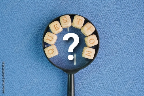 Tableau sur toile Letters of the alphabet and a magnifying glass with the word question