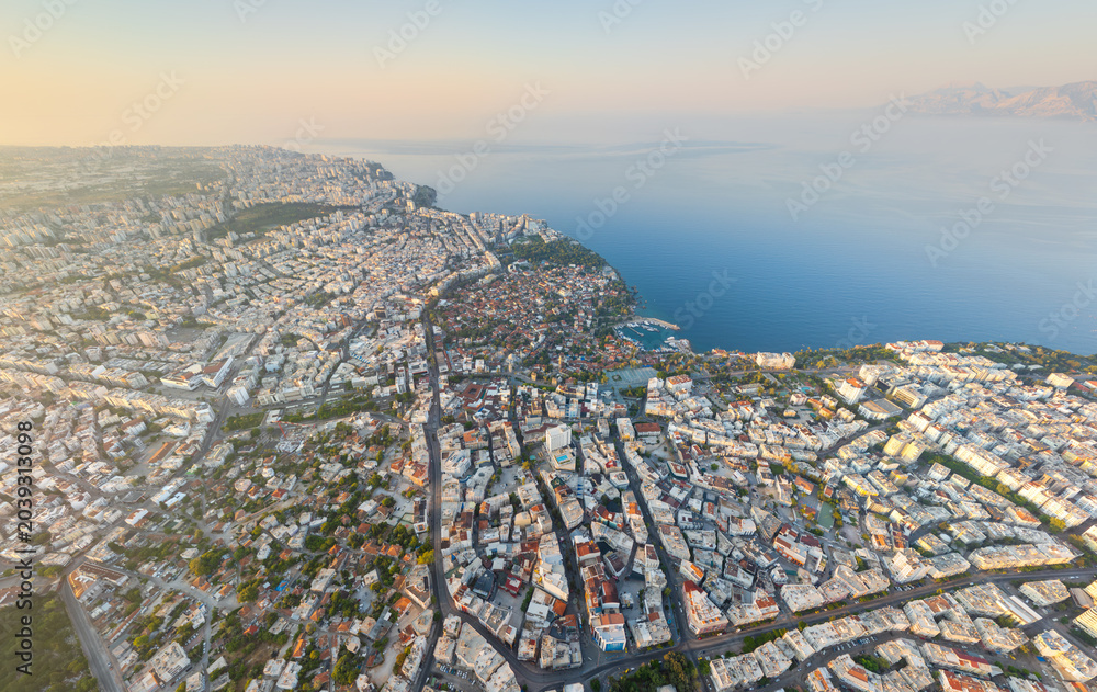Fototapeta premium Antalya, Turkey. Aerial view of the historic Kaleici district nestled between the sea and modern city, highlighting its unique position as an ancient island in a contemporary setting. Aerial view.
