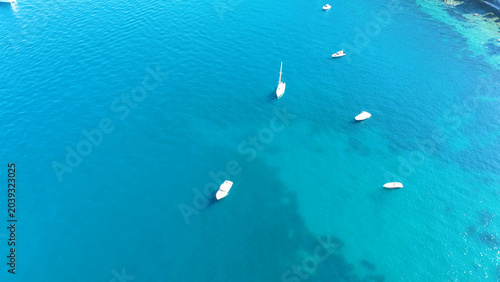 Bild auf Leinwand Aerial View of White Boats Anchored in Turquoise Mediterranean Sea
