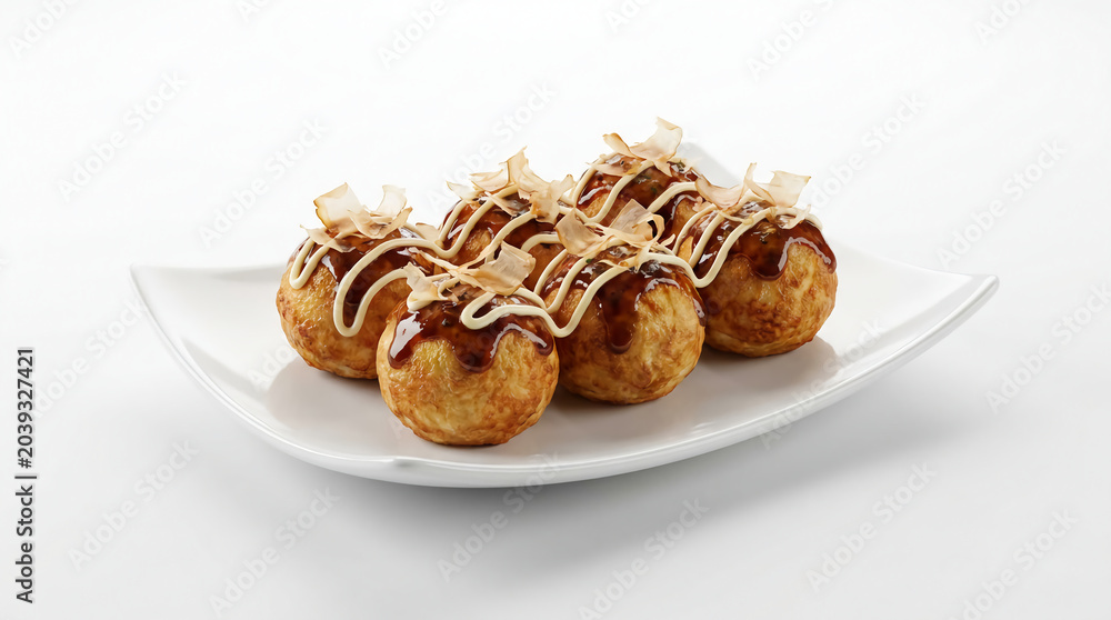 Fototapeta premium Delicious Japanese Takoyaki street food on a white plate, a savory snack with creamy filling and smoky bonito flakes, perfect for culinary exploration