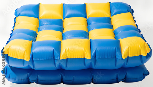 Cuadro en lienzo Blue and yellow checkered inflatable air mattress
