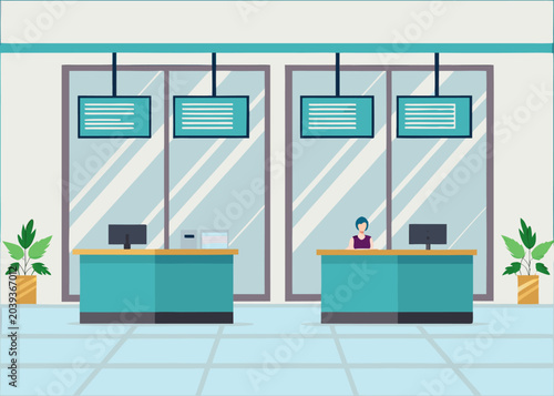 A female employee at a teal service counter in a modern bank office.