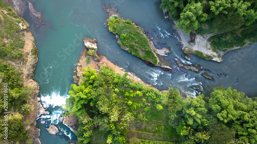 Tableau sur toile Aerial view of rocky turquoise river junction