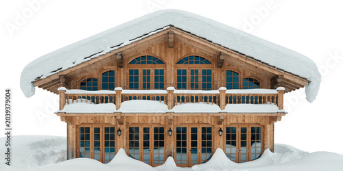 Cozy wooden chalet house covered in heavy winter snow