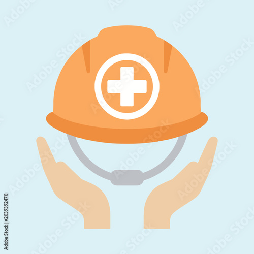 Принти на полотні Hands holding a protective orange hard hat with a white cross