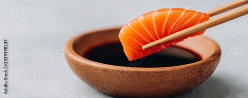 Fresh Salmon Sashimi Slice Dipped in Soy Sauce for Premium Japanese Culinary Branding Luxury Seafood Dining and Authentic Omakase Experience