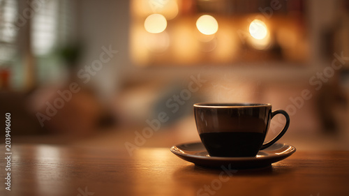 A ceramic dark brown teacup, emanating visible steam, sits on a saucer atop a polished light brown wooden surface. Ai generated