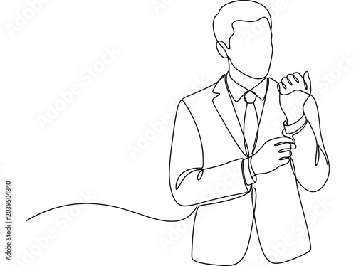 Man in suit adjusting cuffs with focused expression while preparing for business meeting or event