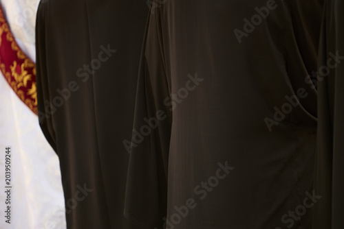 Foto Clergy in black religious vestments