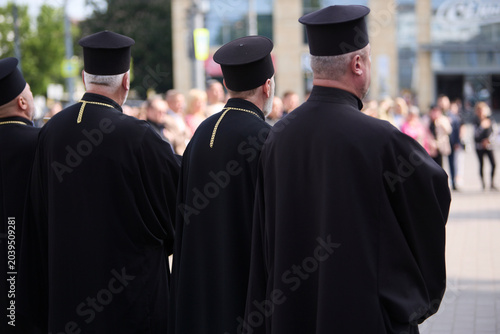Bild auf Leinwand Clergy in black religious vestments
