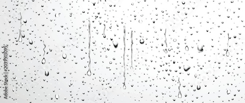 Φωτογραφία Water droplets on a bright light glass pane with high key droplets abstract back