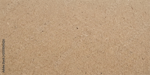 Foto Close-up textured surface of corrugated cardboard, showing the natural brown fibers and slight imperfections of the material