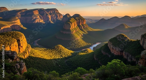 Dramatic Mountain Valley Landscape at Golden Hour with Misty Forest and River
