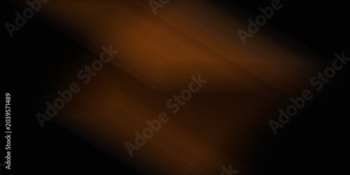 Foto Blurred motion texture with dark orange and golden light streaks across black backdrop creating soft atmospheric energy effect
