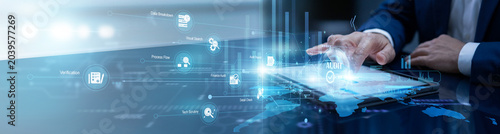 Quadro su tela Financial manager touches the tablet to conduct an Audit, tracking complex fiscal transactions on a global scale to maintain transparency, accuracy, and regulatory integrity today
