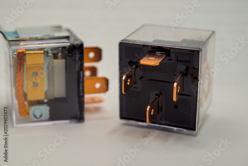 Bottom view of a 4-pin automotive electrical relay
