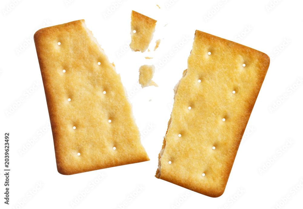 Fototapeta premium Cracked crispy biscuit split into parts with crumbs, isolated on cutout transparent background
