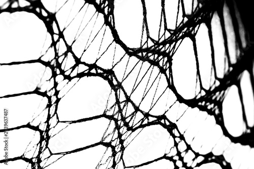 Abstract grunge black and white distressed transparent texture fabric fishnet netting overlay background	