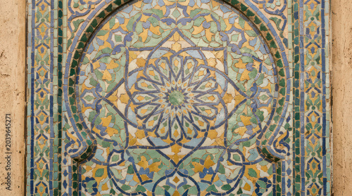 Intricate Islamic Tilework Displaying Geometric Patterns and Floral Motifs.