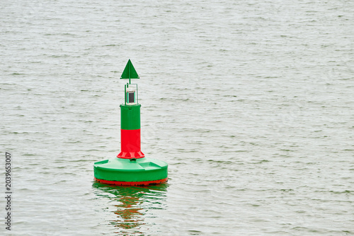 Navigation buoy marking shipping channel in water