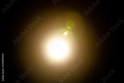 Sun flare on the black background