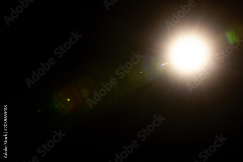Sun flare on the black background