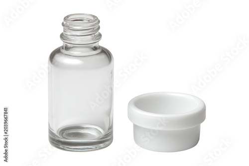 Small empty glass condiment bottle with detached white screw cap in isolated studio shot for professional product packaging design and branding mockup presentation purposes