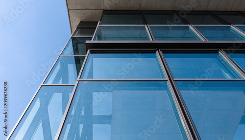 Low angle view of a contemporary glass and steel office building exterior