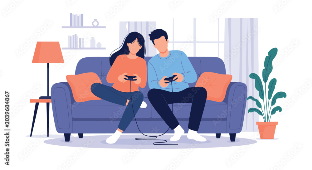 Fototapeta premium Young couple sitting together on a blue sofa while playing competitive video games with handheld controllers in a cozy living room.