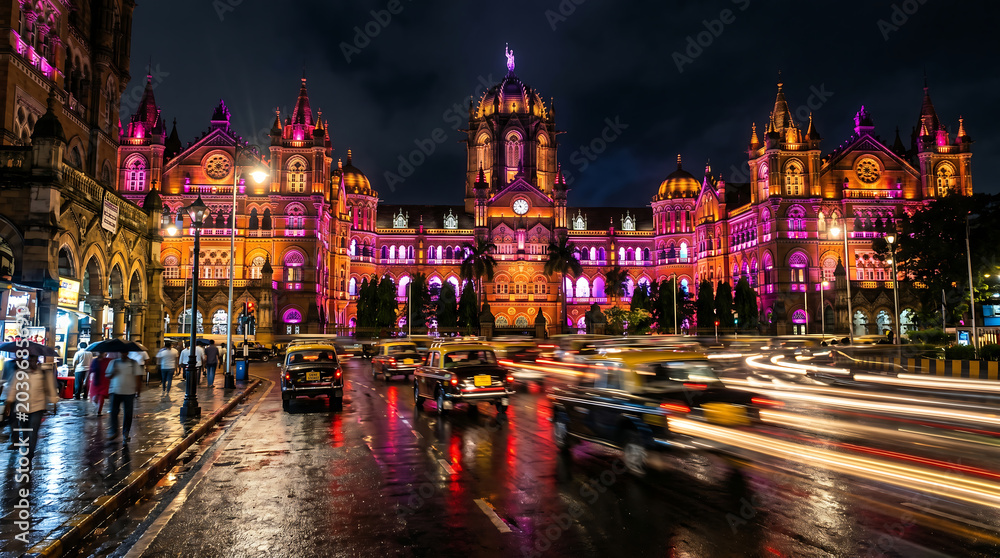 Naklejka premium Mumbai CSMT Train Station Night Illumination Traffic Light Trails India