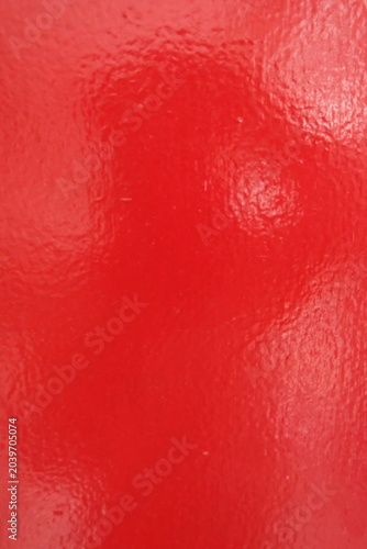 Glossy Red Painted Surface Texture Background with Vibrant Color and Reflection