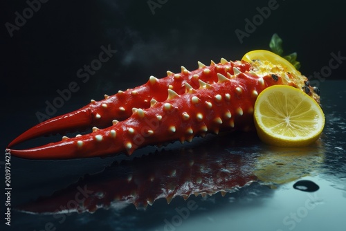 A vibrant, spiky red sea creature with lemon slices, showcasing an intriguing texture against a dark background.