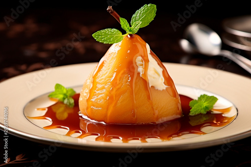 Dessert with caramelized pear on a plate.
