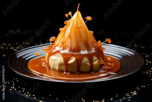 Dessert with caramelized pear on a plate.