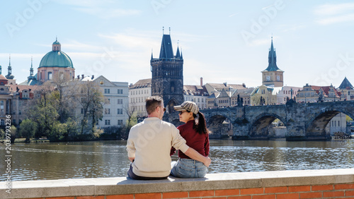 Photos Couple enjoying a romantic moment by the Vltava River in Prague, Czechia during
