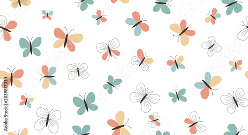 Gentle seamless pattern of small hand drawn colorful butterflies scattered on a white background for nursery or spring theme.