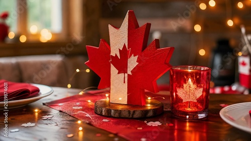 holder. Cozy Canada Day table with maple leaf centerpiece and candle. symbolizing life milestones and joyful moments.