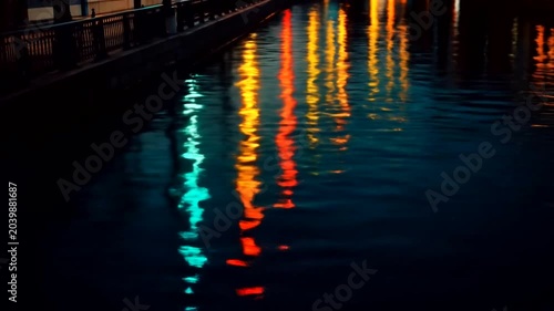 Reflections of City Lights on Water at Night.