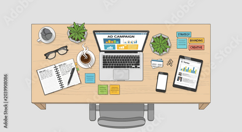 Top view of a modern desk with laptop displaying ad campaign, tablet, smartphone, notebook, coffee and plants.