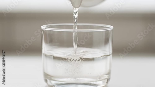 Pouring Clear Water into Glass, Refreshing Hydration, Pure Liquid Refreshment