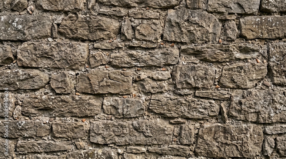 Fototapeta premium Natural Rough Stone Wall – Ancient Fieldstone Rustic Texture Background