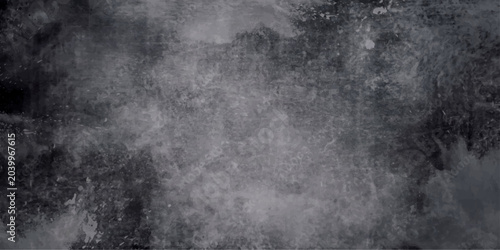 Photos A dark, textured background features black and white water flowing into a rough