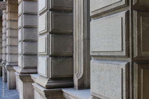 Bild auf Leinwand Architectural detail of the corner of a stone building facade