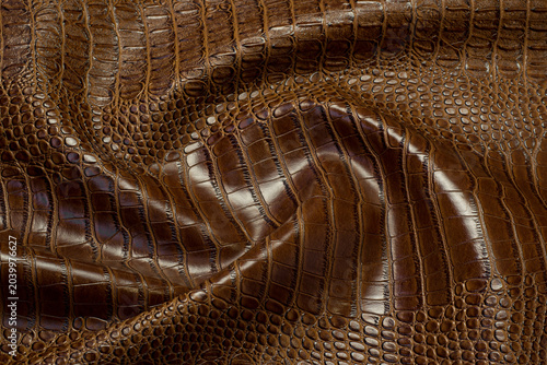 brown crocodile artificial leather with waves and folds on PVC base