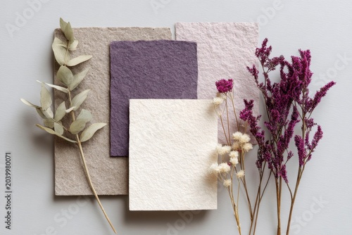 textured paper with dried flowers, muted tones