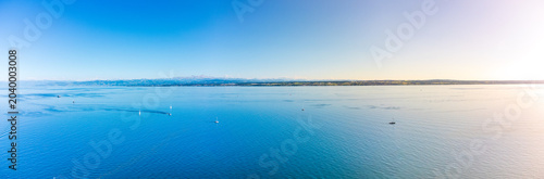 Beautiful drone panorama of Hagnau am Bodensee with historic village houses and the alpine lake.