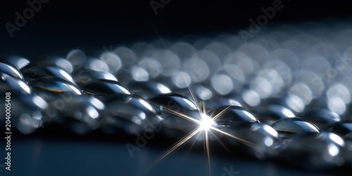 An intricately detailed macro shot of metal chain links, showcasing their shine and texture, illustrating strength, connectivity, and the intricate design present in simple objects.