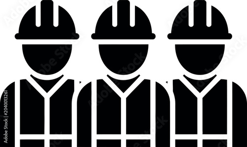 Tableau sur toile Three construction workers wearing hard hats and reflective vests standing toget