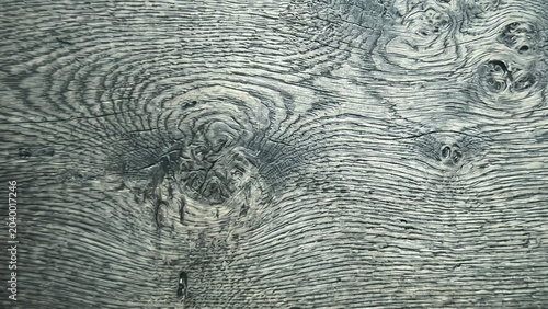 Schilderij op canvas Close-up of a textured wooden surface showcasing intricate grain patterns and natural knots